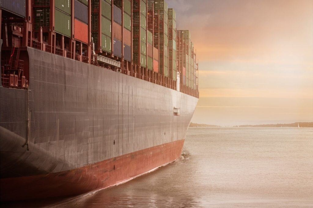 Large ship carrying containers indicates shipping costs